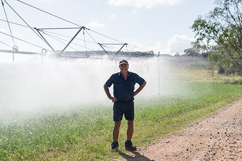 Man standing in front of irrigator